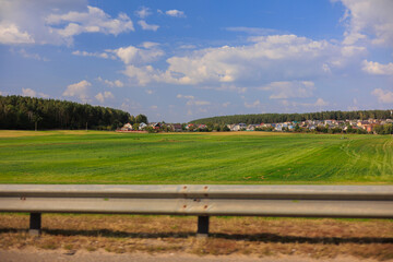 View from the car window to the side of the road, autumn landscape and roadside