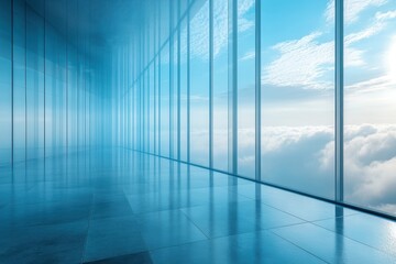 Modern glass corridor with panoramic views of clouds and blue sky in a high-rise building