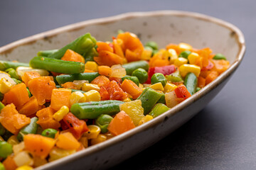 Mexican Mix of Vegetables. Tomatoes, Green Beans, Peas, Corn. Dietary Food.Bright vegetable mix .Vegetarian food.Assorted.