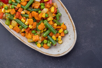 Mexican Mix of Vegetables. Tomatoes, Green Beans, Peas, Corn. Dietary Food.Bright vegetable mix .Vegetarian food.Assorted.
