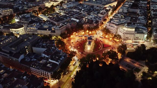 Aerial view of Madrid at night, capital of Spain, drone view of Puerta de Alcala, Puerta de la Independencia in Madrid, Spain at night with night lights.