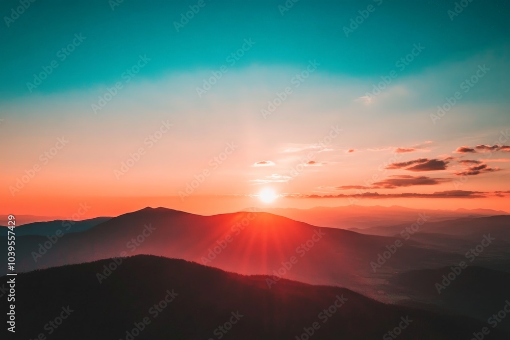 Poster this image captures the setting sun over distant mountains, with long shadows cast across rolling hi