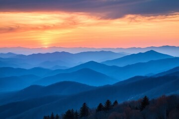 Obraz premium The setting sun casts golden shadows over undulating mountain ranges, creating a kaleidoscope of warm tones that fill the landscape with radiant, serene beauty.