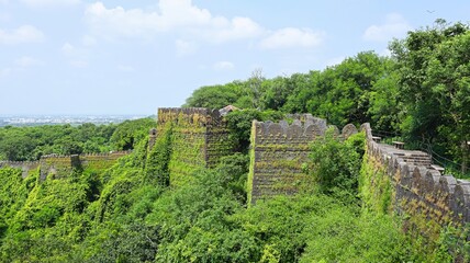 Fototapeta premium Ruined protective wall of Uparkot Fort, Junagadh, Gujarat, India.