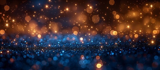 Obraz premium legant black and dark abstract background with grainy texture, featuring Christmas stars and glistering bokeh in blue and gold. Ideal for festive banners, holiday posters, or winter decoration designs