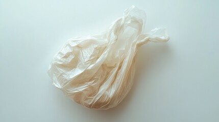 Crumpled plastic bag with deep wrinkles, showcasing texture, isolated on white background