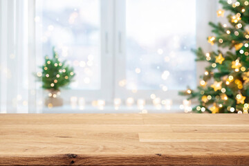 Wooden table for display products with blurred Christmas tree and window interior background