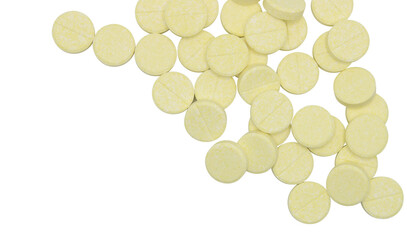 Top view. Yellow vitamin C tablets on isolated background.