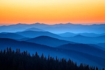 Obraz premium Endless blue mountain ridges stretch across the horizon as the sun sets, draping the sky in a colorful ambiance that captures the endless beauty of the great outdoors.