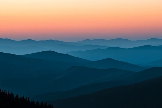 Ambient twilight hues envelop a series of dusky mountain ranges, offering a serene and calming landscape view that transitions beautifully from day to night.