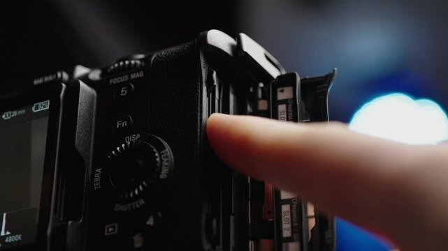 Close-up view of the memory card being inserted into the Sony FX3