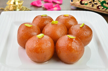 Gulab Jamun sweet dish served in a plate.