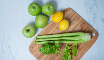 Green apple ginger lemon and celery stalks. detox concept and healthy food