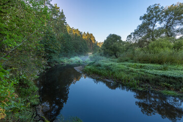 A river with a blue sky in the background