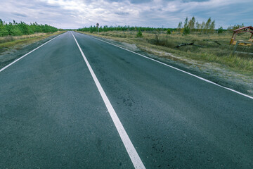 A long, empty road with a white line down the middle