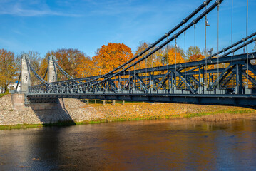 A fragment of the old chain bridge over the Velikaya River. Ostrov city of Pskov region, Russia