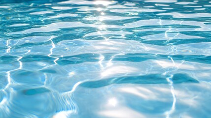  A crystal-clear swimming pool filled with blue water reflects the sun at its surface A white frisbee floats undisturbed in the pool's center