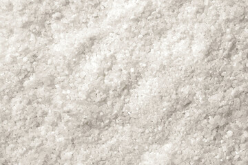 White salt as background. Coarse sea salt, top view