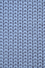 texture of knitted light blue sweater, close-up texture of beige knitted fabric, macro texture of blue knitted woolen clothes