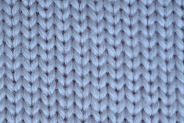 texture of knitted light blue sweater, close-up texture of beige knitted fabric, macro texture of blue knitted woolen clothes