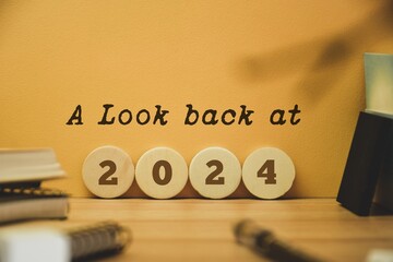 A Look back at the year 2024 concept with wooden chips and inscription. Best events of the year,...
