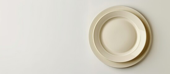 Beige ceramic plate with copy space image against white background