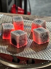 Fire burning from coconut charcoal briquette for business production