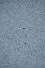 old gray cracked wall texture as background, old spackled textured gray white wall as background 