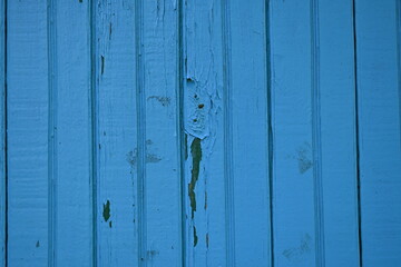 blue wooden surface close-up, blue painted wood as background, symmetrical boards as background, wooden painted blue surface 