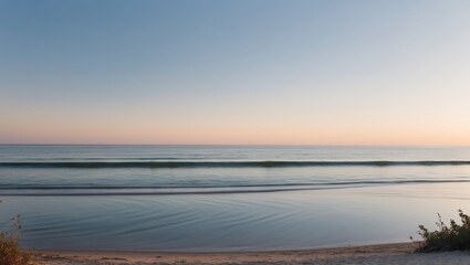 Obraz premium Tranquil Beach at Sunset Over Water Waves.