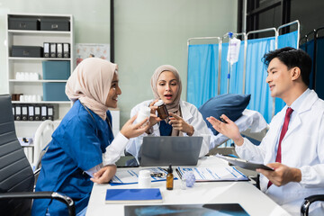 Obraz premium Diversity, medical team head leaders discuss results, brainstorming and planning. Doctor, nurse and computer on desk.
