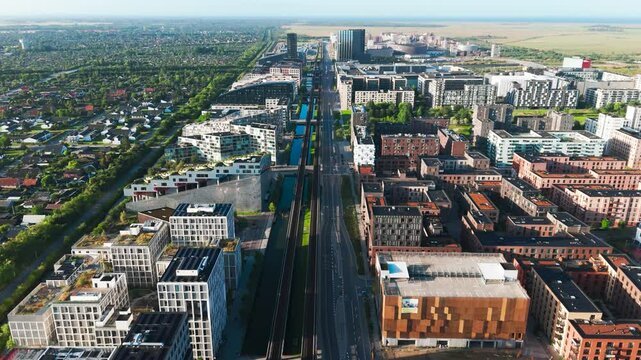Aerial view of Orestad main metro line through city neighborhood, Denmark