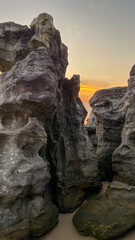 Towering rock formations at sunset, highlighting nature's erosion and resilience, perfect for travel and adventure themes