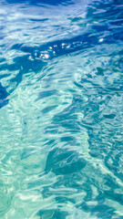 Clear turquoise ocean water reflecting sunlight, evoking relaxation and peace, ideal for summer vacation themes and beach holiday promotions