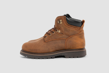 Brown leather boots on white background. Fashion 