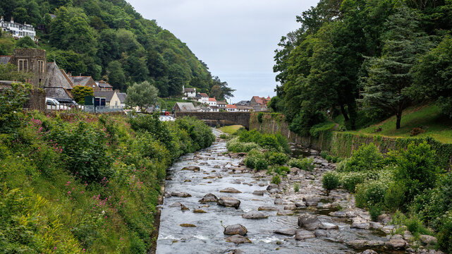 A view of the Lyn River with footpath to Watersmeet. Lynmouth, Exmoor, Devon, UK