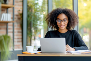 Focused woman working in a bright office