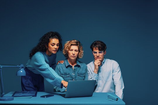 Brainstorming meeting with a manager in a monochromatic blue office,