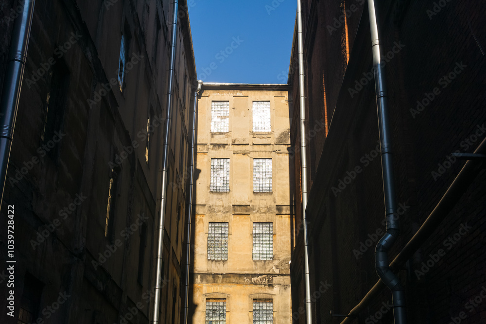 Wall mural industrial architectural background, vintage buildings of an old factory workshops