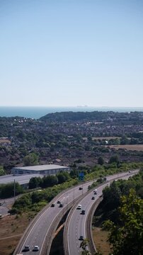 Busy road from above with sea in the background on a sunny day