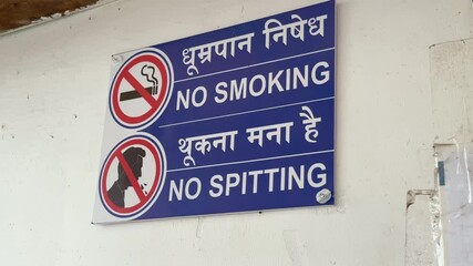 No smoking and no spitting sign installed on the wall in india