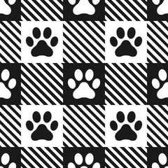 Domestic pet's paws prints on gingham background. Black and white vector seamless pattern.