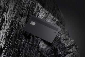 Black Credit Card on Dark Rock 