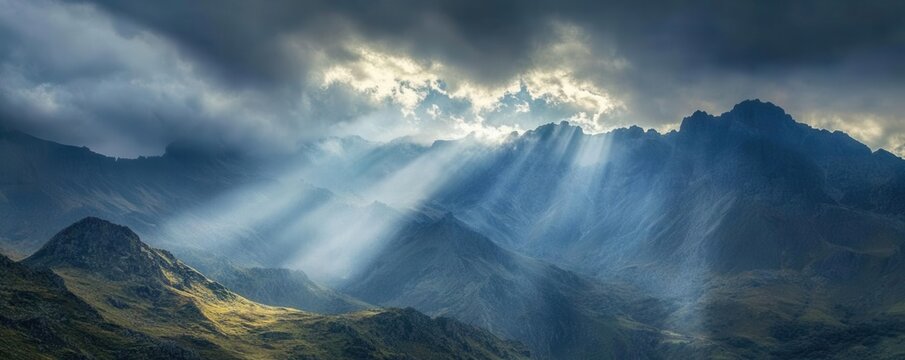 Mountain landscape image of a dramatic storm rolling over rocky peaks, sunlight breaking through the clouds, creating a striking contrast of light and shadow