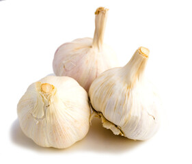 Garlic heads and cloves on white background