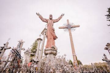 A large collection of wooden crosses, crucifixes, and rosaries displayed at Kryžių Kalnas (Hill...