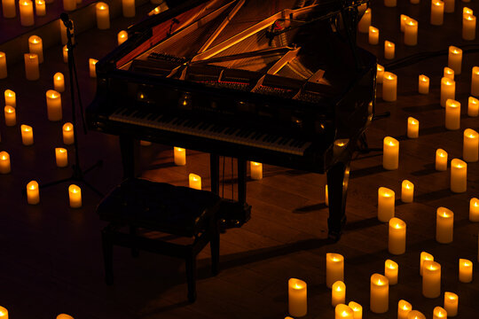 Steinway and Sons black pianoforte with lots of candles