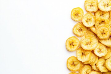 Brightly colored dried banana chips are neatly placed on a clean white surface, showcasing their crunchy texture and natural sweetness. Ideal for snacking or adding to recipes.