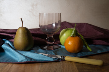 still life with apple pear and mandarine
