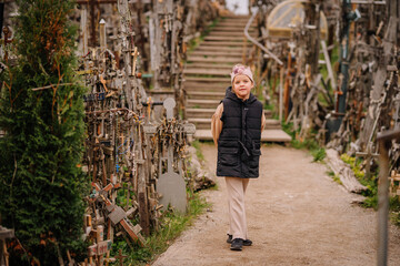 A large collection of wooden crosses, crucifixes, and rosaries displayed at Kryžių Kalnas (Hill...
